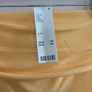 Orange asymmetrical top from Urban Outfitters, never worn. Size:S